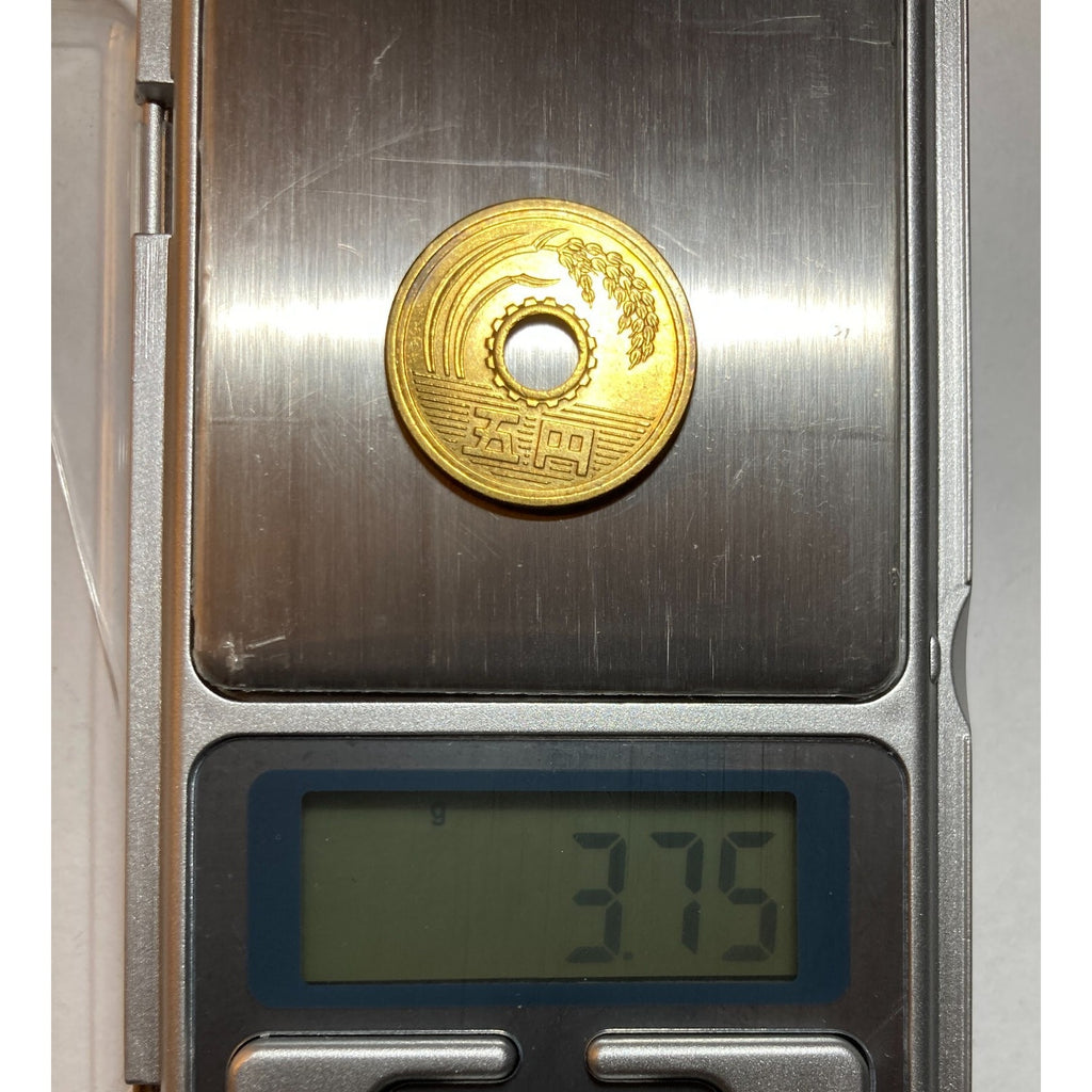 Japanese Money, 5 Yen Coin - a coin with a center hole, Random Year