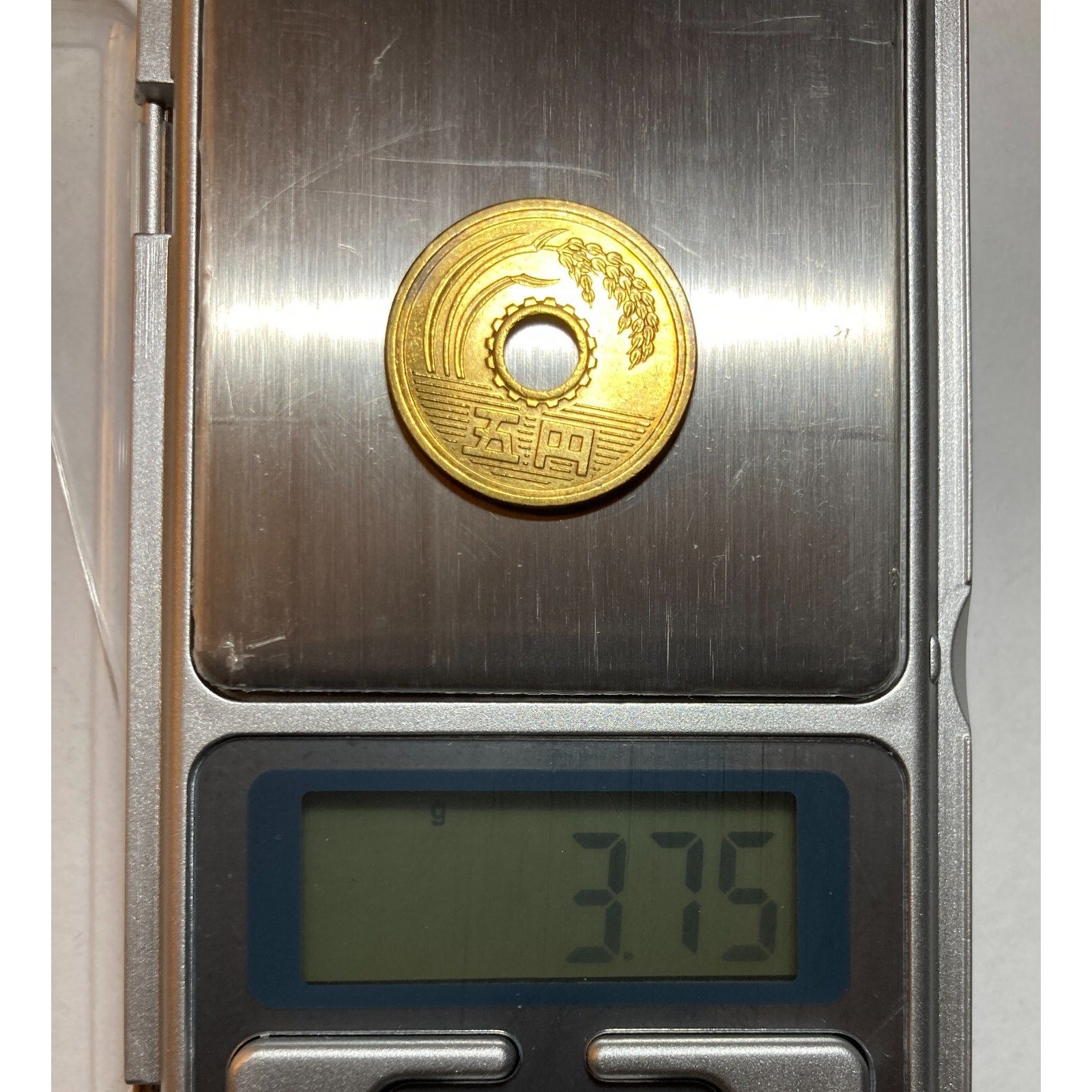 Japanese Money, 5 Yen Coin - a coin with a center hole, Random Year